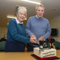 Longest serving Life Members, Brenda and Ron Shimmin cut the 85th Anniversary Cake